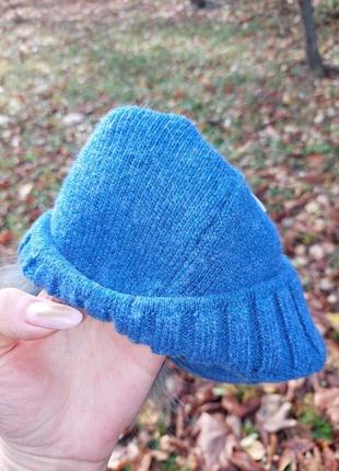 Голубая шапка с косами с натуральным бубоном4 фото