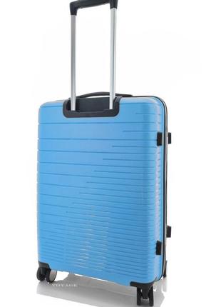 Дорожня пластикова валіза велика l madisson на 4 колесах блакитна2 фото