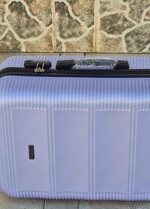 Качественный чемодан чемодан wings 203 лаванда средной размер6 фото