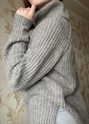 Удлиненный теплый свитер с разрезом4 фото