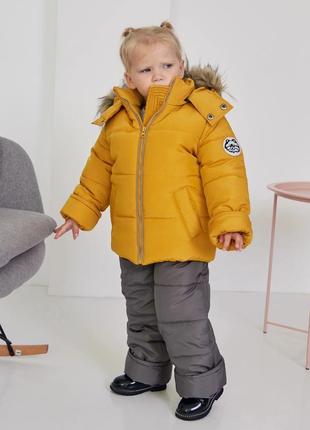 Дитячі зимові комбінезони