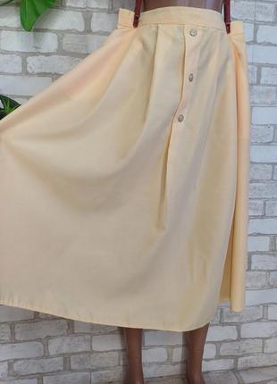 Новая лаконичная юбка миди в сдержанном желтом цвете с карманами, размер л-2хл5 фото