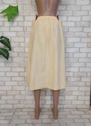 Новая лаконичная юбка миди в сдержанном желтом цвете с карманами, размер л-2хл2 фото