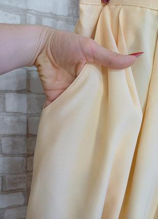 Новая лаконичная юбка миди в сдержанном желтом цвете с карманами, размер л-2хл8 фото