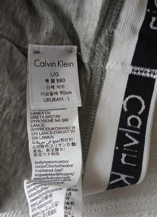 Серый хлопковый бюстгальтер топ фирмы calvin klein размер l3 фото