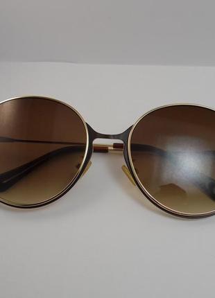 Круглые коричневые очки в золотой оправе8 фото