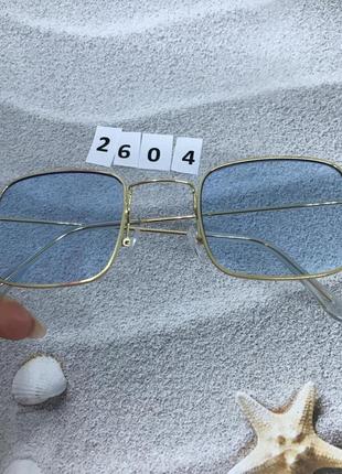 Стильные очки с голубыми линзами в золотистой оправе5 фото