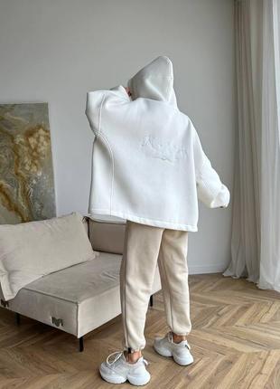 Стильные теплые брюки джоггеры с накладными каоманами из качественной ткани10 фото