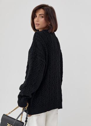 Вязаный свитер оверсайз с узорами из косичек8 фото
