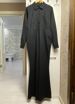 Черный джинсовый комбинезон с брюками клеш и высокой посадкой6 фото