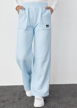 Трикотажные брюки на флисе с накладными карманами