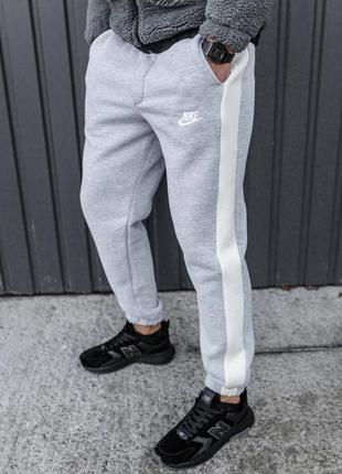 Зимние серые спортивные штаны брюки на манжете nike на флисе сірі спортивні штани на флісі nike7 фото