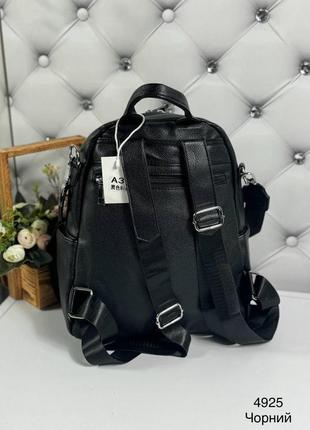 Стильная женская сумка-рюкзак черного цвета из экокожи.6 фото