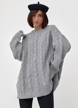 Вязаный свитер оверсайз с узорами из косичек.1 фото