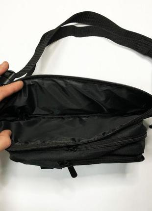 Качественная и надежная тактическая сумка-бананка из прочной и водонепроницаемой ткани черная через плечо9 фото