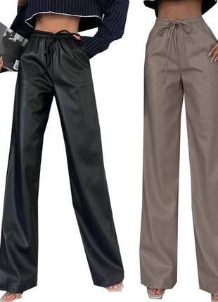 Штани жіночі з екошкіри на флісі, молодіжні трендові штани утеплені зі шкірозамінника широкі 532922 фото