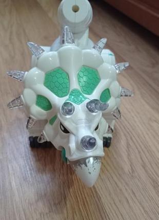 Іграшка музичний динозавр на батарейках1 фото