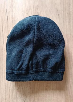 Молодежная вязаная шапочка с отворотом на микрофлисе
шапка средней плотности,
цвет черный4 фото