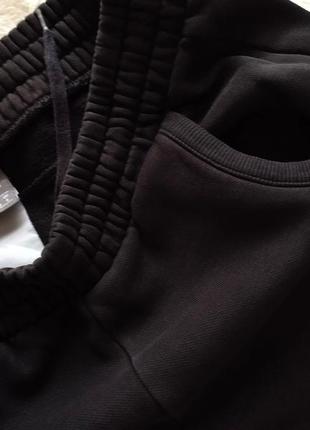 Спортивні штани від puma чорні xs6 фото
