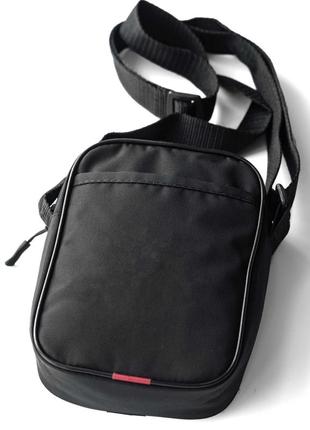 Молодежная сумка через плече барсетка champion черная тканевая4 фото