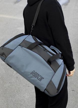 Дорожня спортивна сумка найк на 55 літрів сірого кольору10 фото
