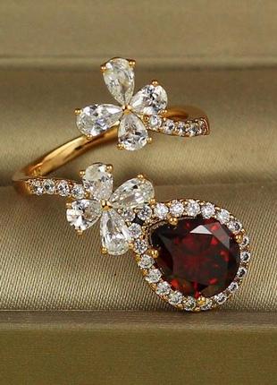 Кольцо  xuping jewelry марсель с красным камнем раздвижное р 18 золотистое2 фото