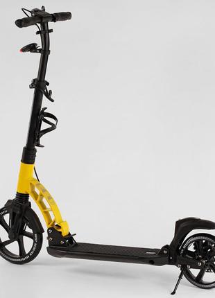 Самокат двоколісний best scooter d-20477 чорно-жовтий з ручним гальмом, фарою, амортизацією, pu 23см/20см2 фото