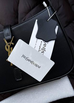 Черная кожаная сумка ysl с золотым логотипом10 фото