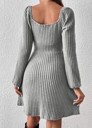Трикотажна жіночна сукня міні  коротка з довгими рукавами і завʼязками на грудях мустанг7 фото