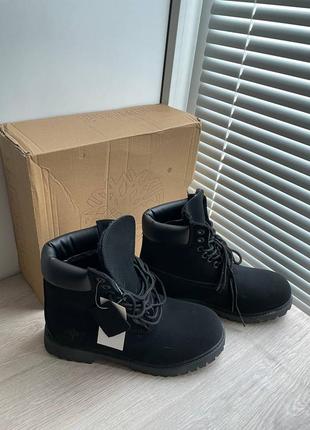 Нові зимові ботинки timberland чорні матові1 фото