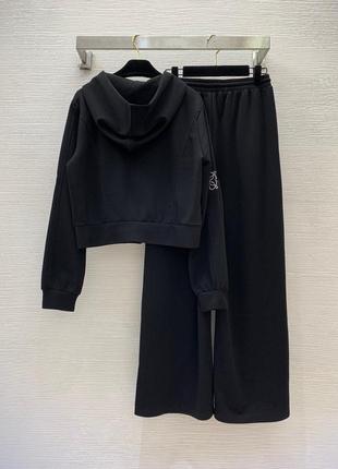 Бежевый костюм loew женский черный брюки кофта9 фото
