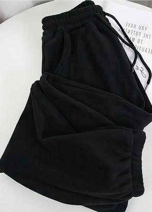 Теплі штани на флісі жіночі з манжетами7 фото