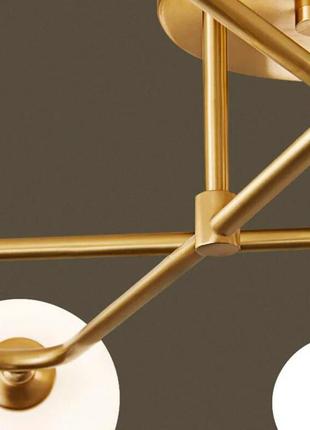 Стельова люстра в латунному корпусі з вигнутими ріжками на 6 ламп2 фото