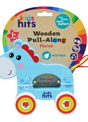 Деревʼяна іграшка-каталка "wooden pull-along: коник" дерево блакитний