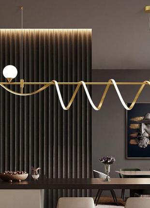 Дизайнерский светильник led в золотистом корпусе.2 фото