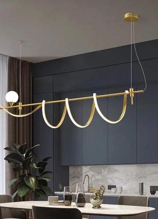 Дизайнерський led світильник у золотистому корпусі