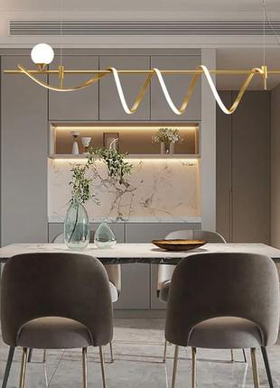 Дизайнерский светильник led в золотистом корпусе.4 фото