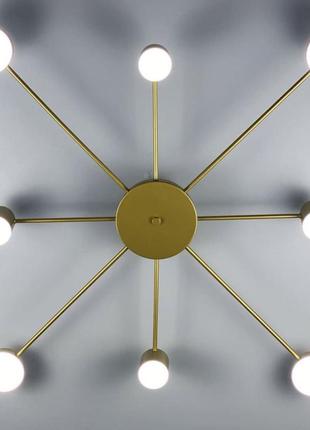 Стельовий led світильник золотистого кольору.2 фото