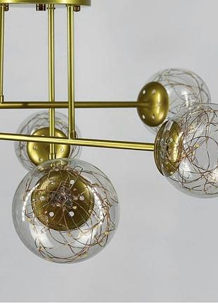 Стельова led люстра на 6 плафонів у золотистому корпусі.4 фото
