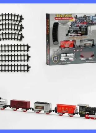Іграшкова дитяча залізниця зі звуковими ефектами та підсвіткою, локомотив із 4 вагонами1 фото
