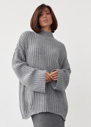 Жіночий в'язаний светр oversize в рубчик1 фото