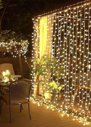 Новорічна світлодіодна гірлянда штора 2х2м 240led від мережі 220v тепле біле світло7 фото