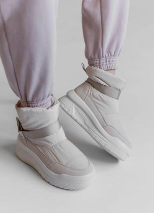 Білі кросівки-дутики - ваш стильний та комфортний вибір для активного життя ❄️4 фото