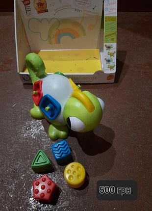 Продам игрушку развивающую хамелеон