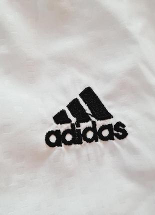 Біла вітрівка на замочку adidas.4 фото