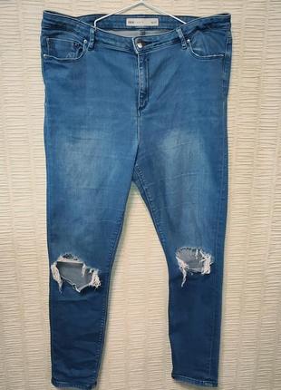 Темно-голубые стрейчевые рваные джинсы2 фото