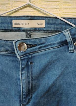 Темно-голубые стрейчевые рваные джинсы4 фото