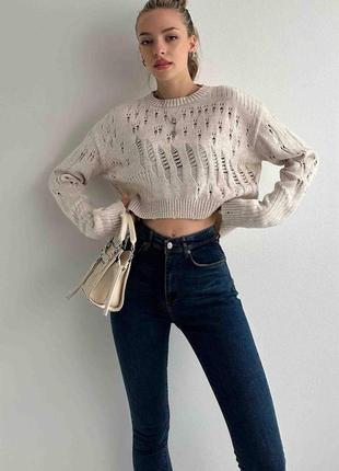Стильний жіночий рваний светр укорочений трендовий1 фото