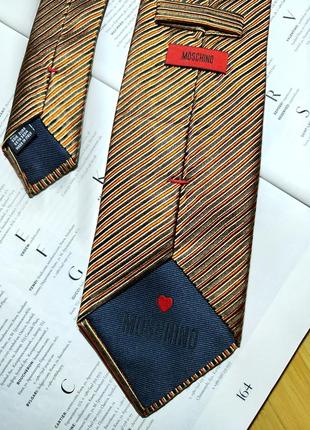 Moschino❤️ производство итальялия
шовкова краватка в смужку5 фото