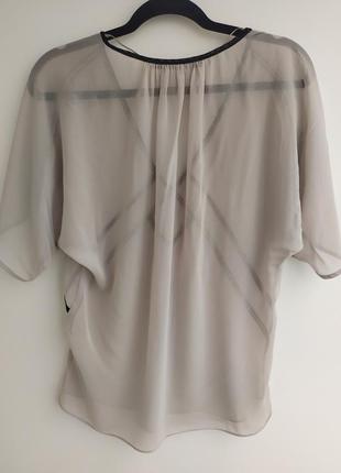 Блуза свободного кроя,со спущенными рукавами.2 фото